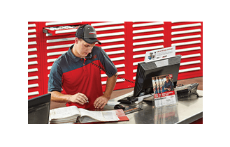 Man working at Parts Department Counter
