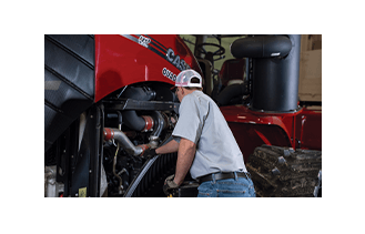 Man working on Case Equipment